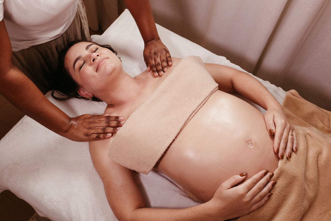 Home Pregnant woman enjoying a soothing prenatal massage in a spa. Relaxation and pampering at its best.